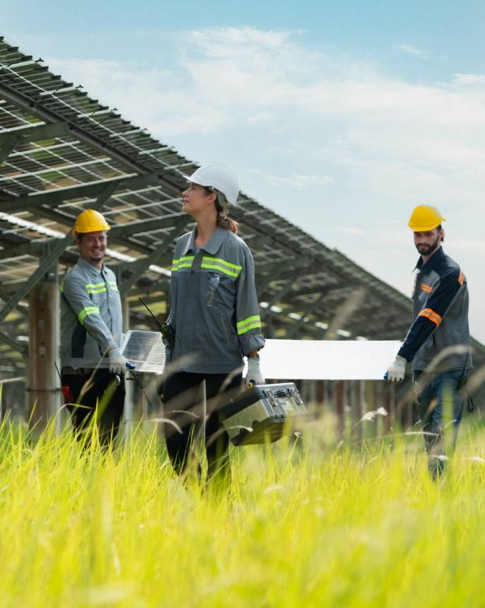 Solar panel workers walking by solar button