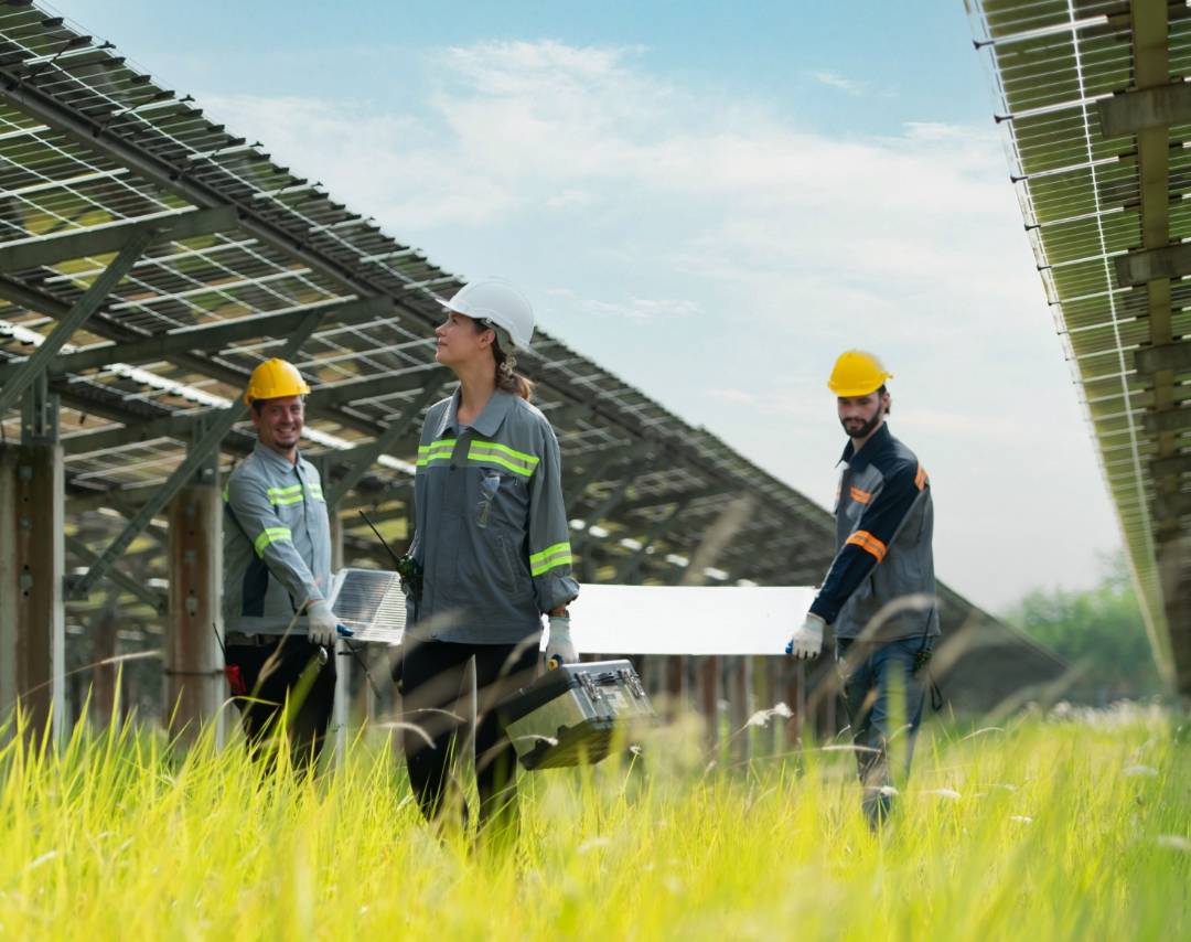 Solar panel workers walking by solar button